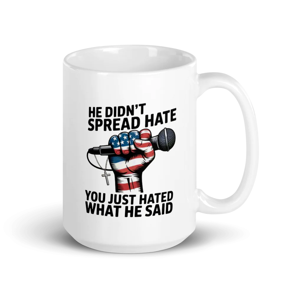 White mug with a design of a fist holding an American flag, microphone, and cross, with text on a white background.