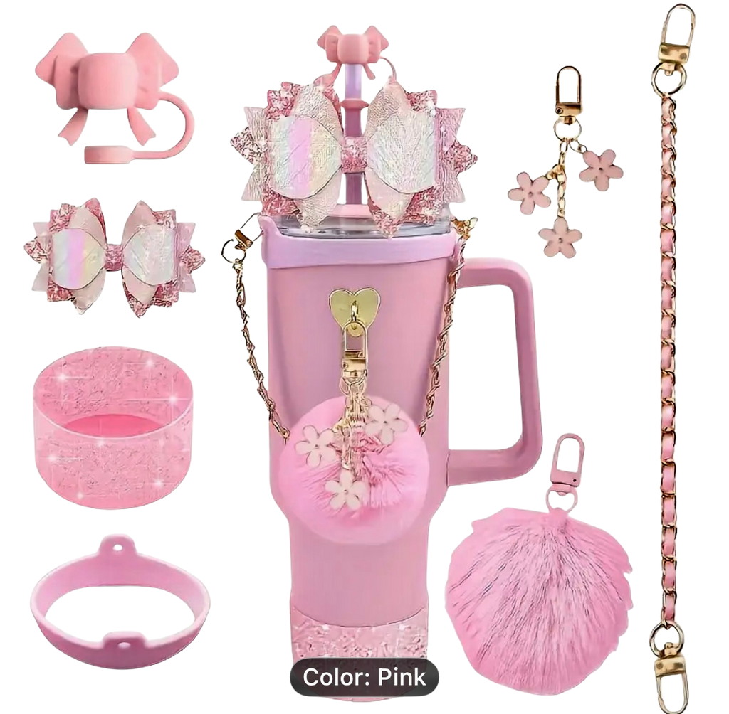 Collection of LIGHT pink accessories including a cup, charms, and clips on a white background.