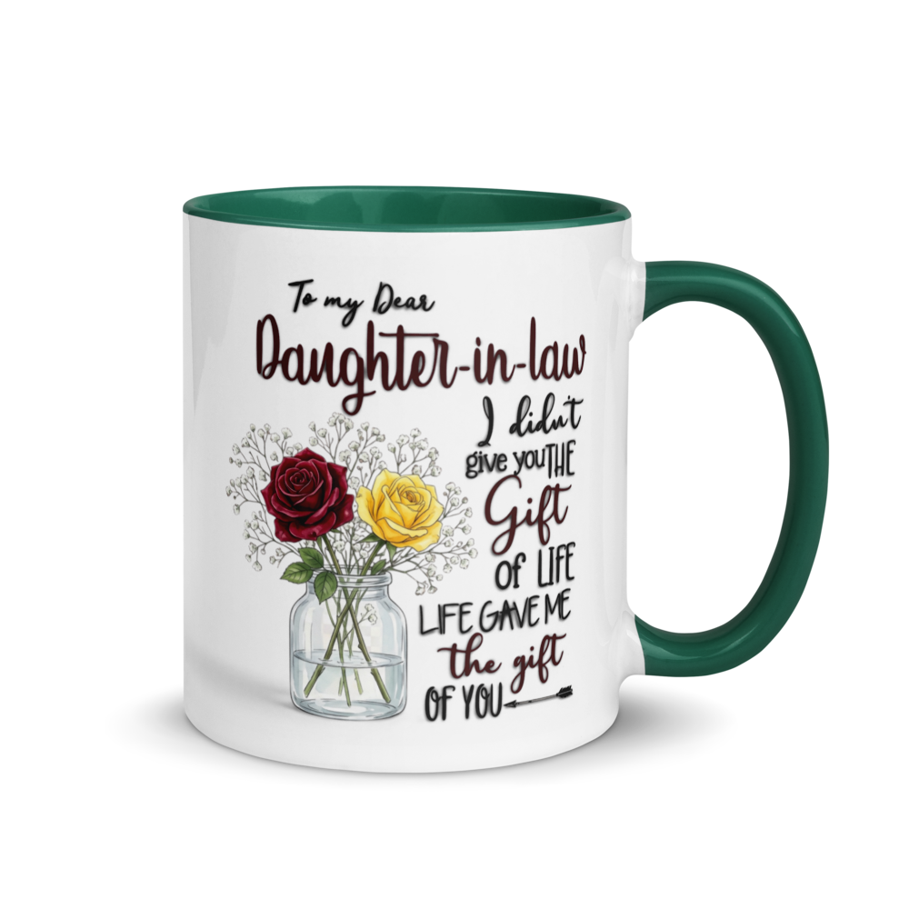 A white ceramic mug with a dark green interior, handle, and rim, featuring a printed message for a daughter-in-law and an illustration of red and yellow roses in a glass vase.