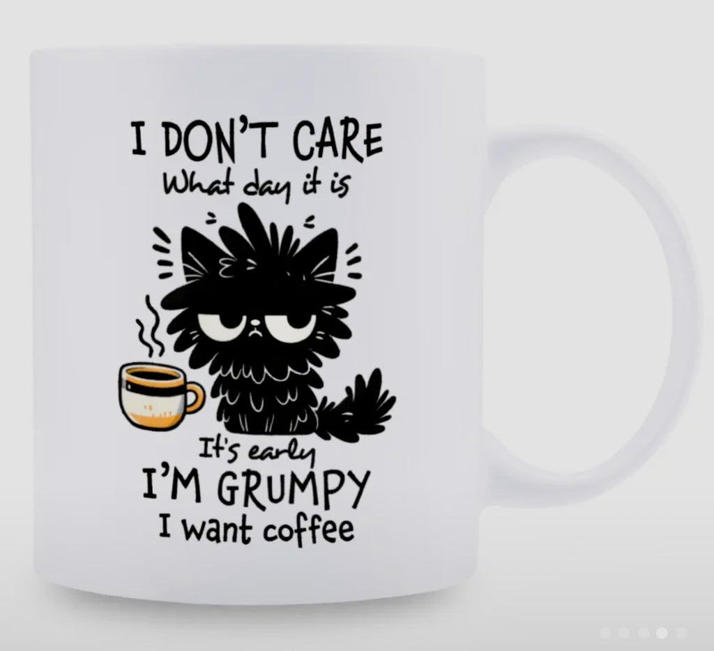White mug with black text and a cartoon GRUMPY CAT holding a coffee cup on a white background