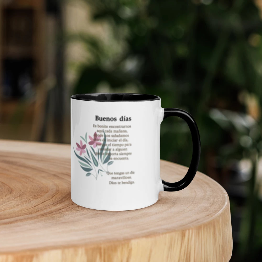 White mug with black interior and handle on a wooden surface with blurred greenery in the background