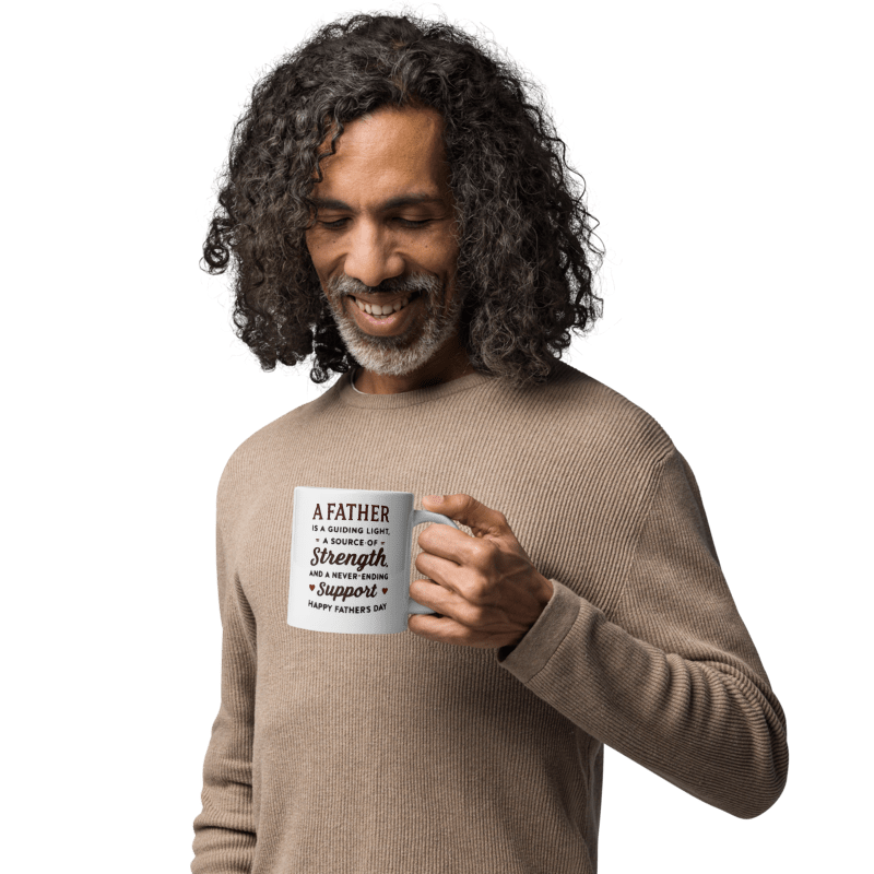 Man holding a mug with a Father's Day message on a white background