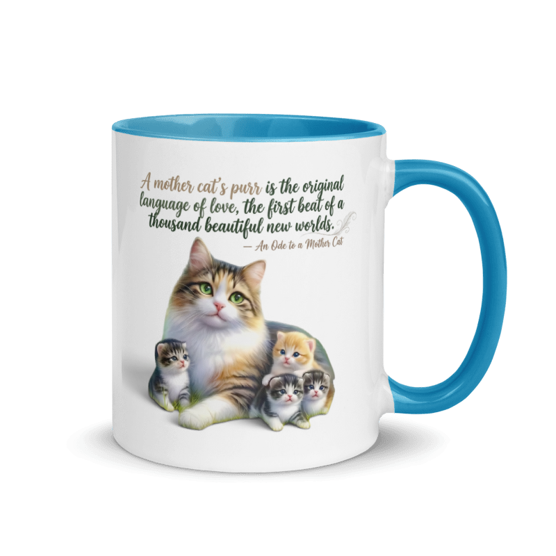 A white ceramic coffee mug with a bright blue interior, handle, and rim. The front features a printed illustration of a mother cat with four kittens and a quote that reads, 'A mother cat's purr is the original language of love, the first beat of a thousand beautiful new worlds.