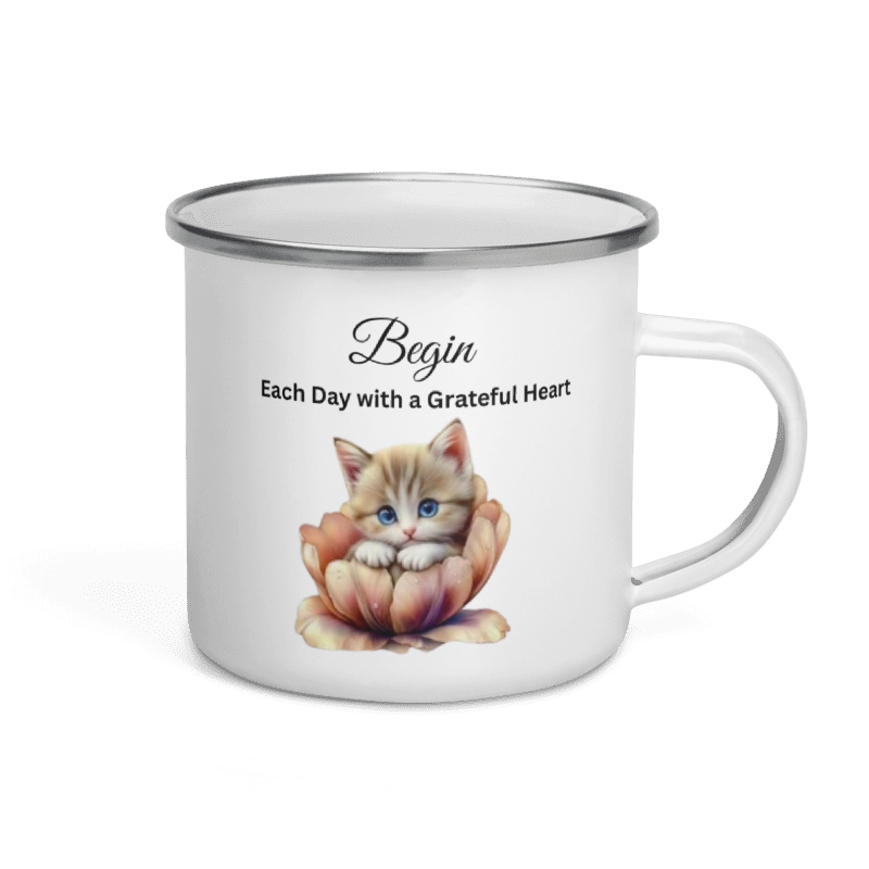 A white enamel-style mug with a silver rim and handle, printed with the words 'Begin Each Day with a Grateful Heart' above an illustration of a small orange kitten sitting in a peach flower.