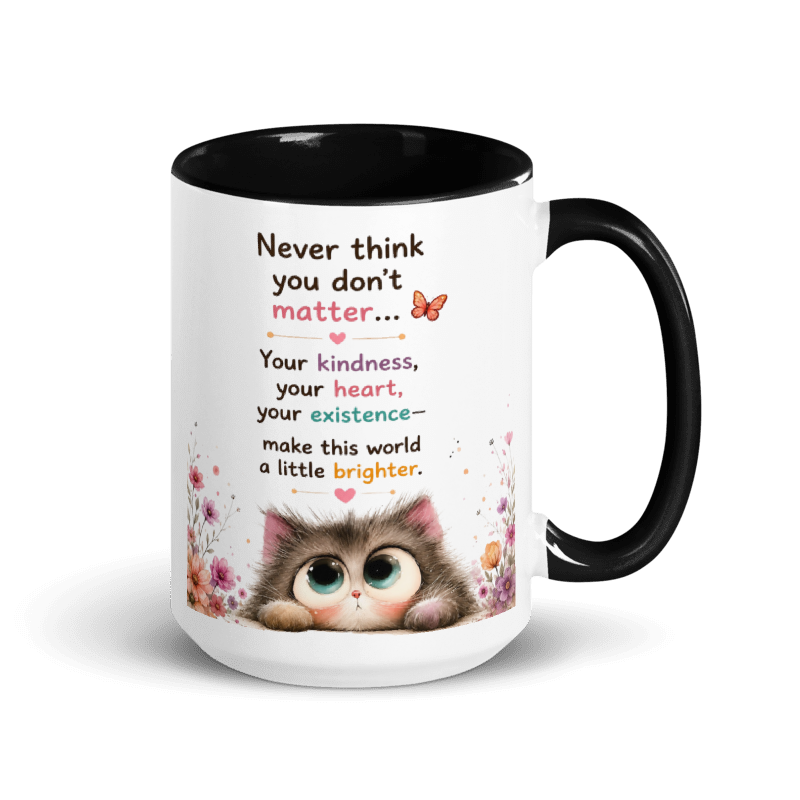 A white ceramic mug with a black interior and black handle, featuring a printed design of a cute cartoon kitten and a sentimental quote.