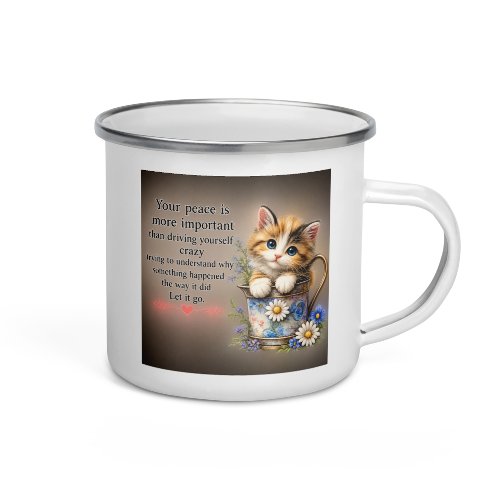 A white enamel camp mug with a silver rim and handle, featuring a printed graphic of a cute orange tabby kitten sitting in a floral cup next to a quote 