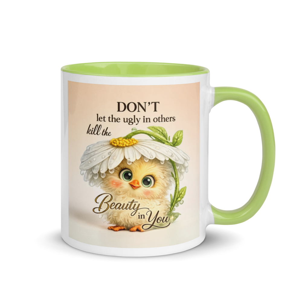 A white ceramic mug with a light green interior and handle, featuring a printed design of a cute yellow chick under a daisy with the text 'DON'T let the ugly in others kill the Beauty in You'.