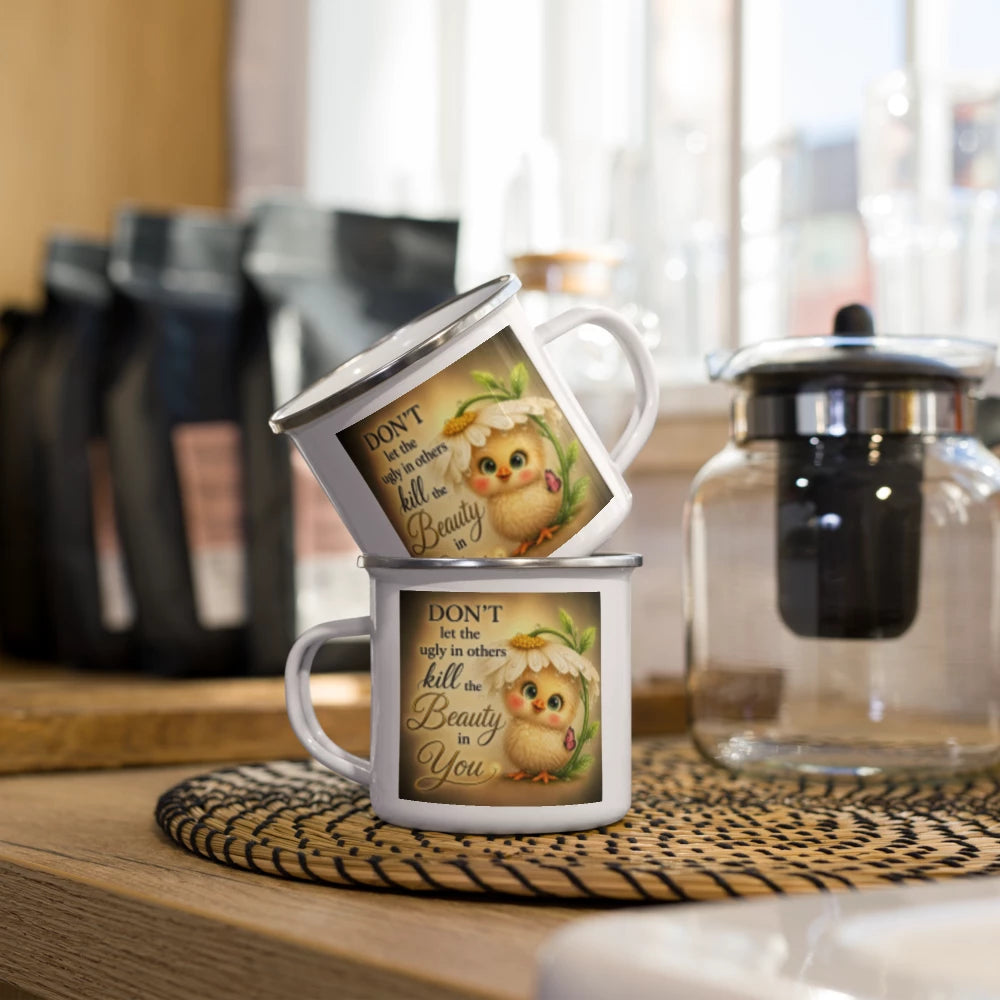Two stacked white enamel-style mugs with a cute cartoon owl illustration and the text 'DON'T let the noise in your head kill the Beauty You' on a wooden table in a kitchen setting.