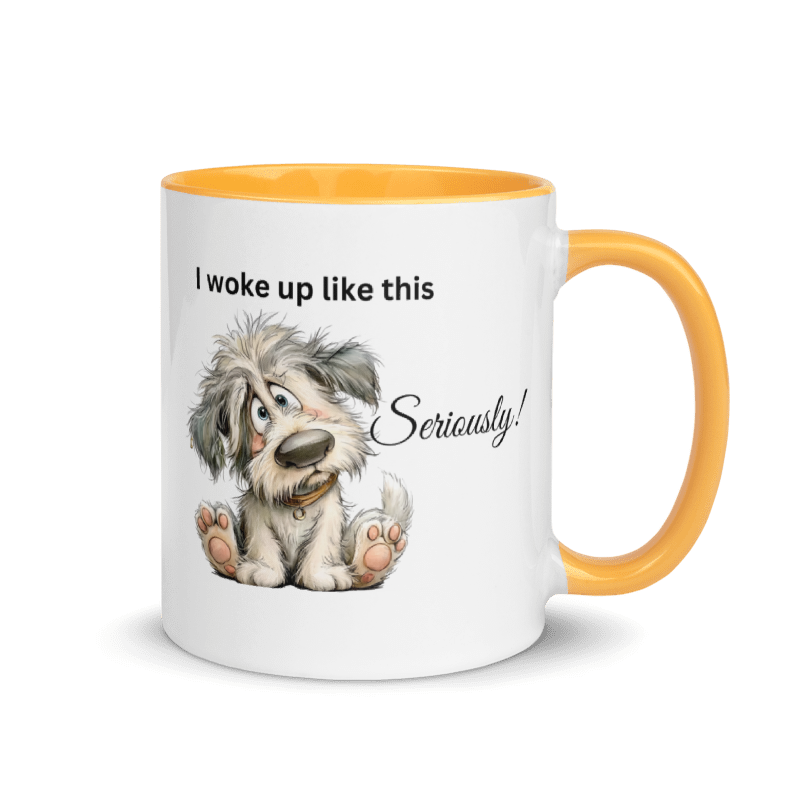A white ceramic mug with a yellow interior, yellow handle, and a cartoon dog graphic with the text 'I woke up like this Seriously!'.