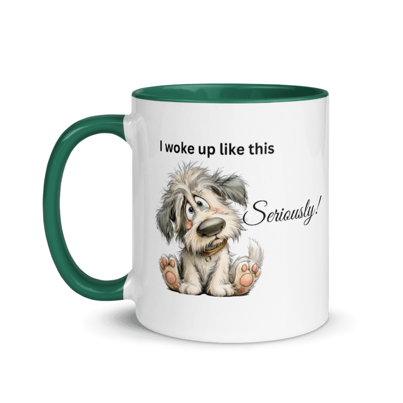 A white ceramic mug with a dark green handle and interior, featuring a cartoon illustration of a fluffy gray dog and the text 'I woke up like this Seriously!' 