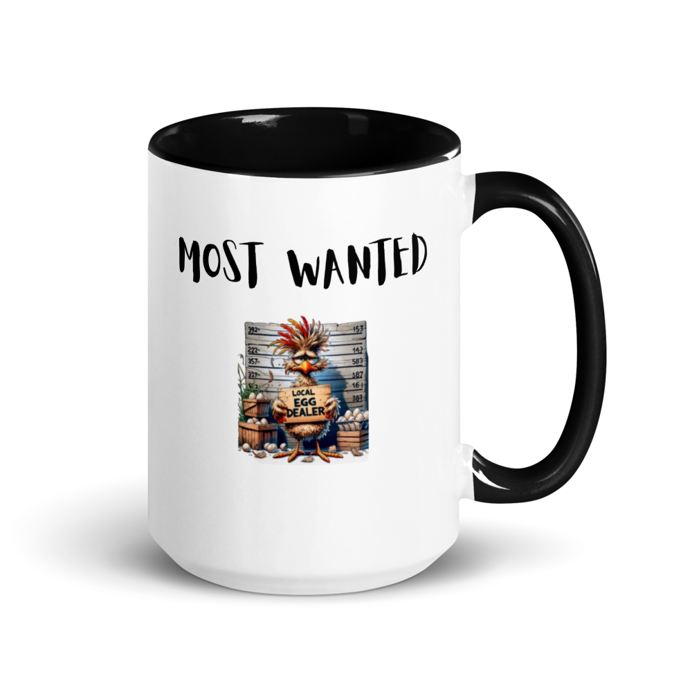 White mug with black interior and handle featuring a graphic of a rooster and text 'MOST WANTED LOCAL EGG DEALER'.