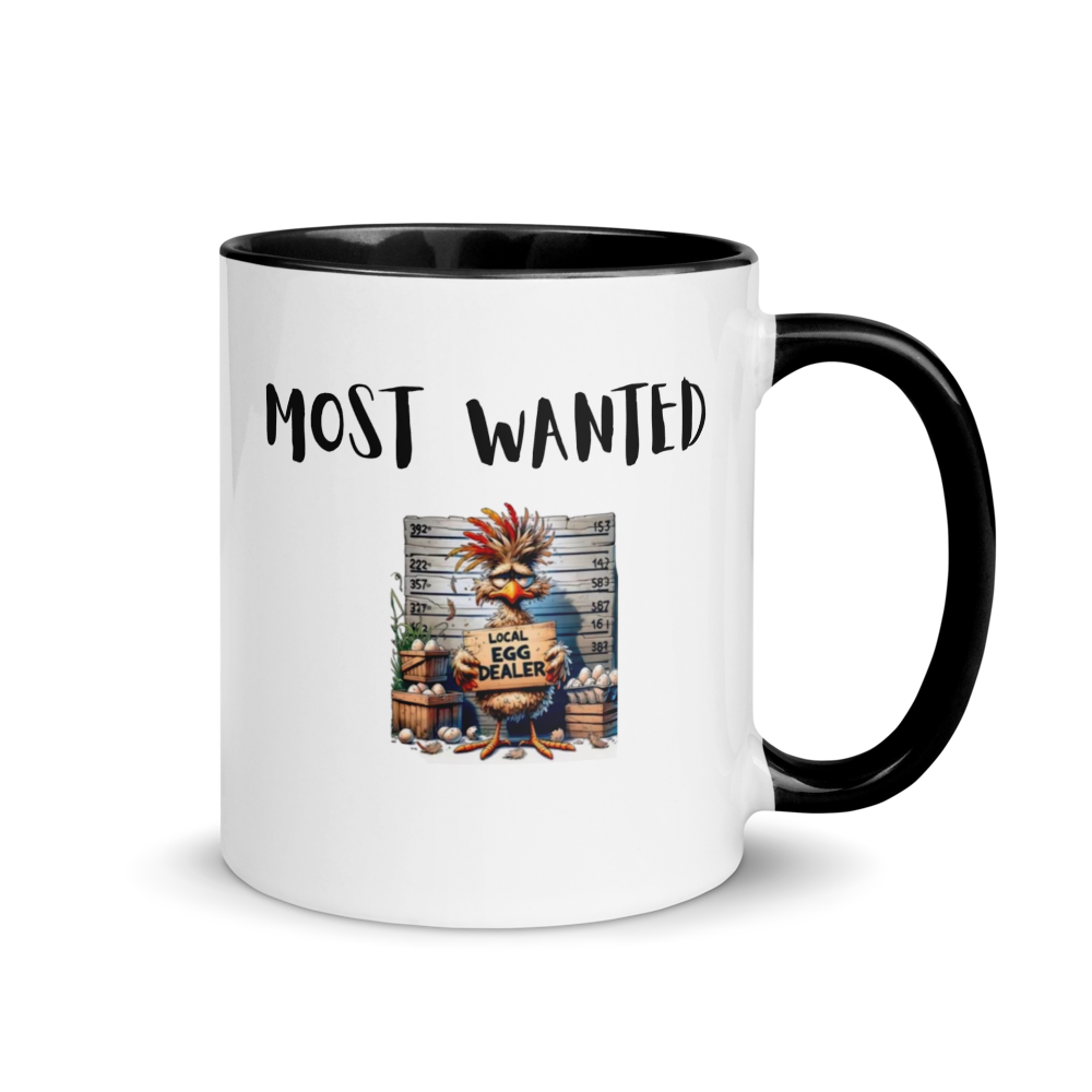Mug with 'Most Wanted' text and cartoon character design on a white background