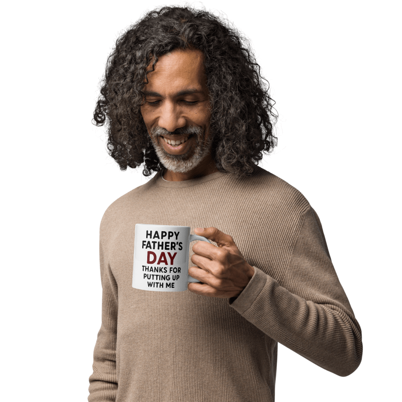 Man holding a mug with 'Happy Father's Day' text on a white background