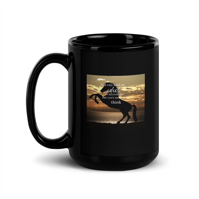 Black mug with a horse silhouette and sunset design 