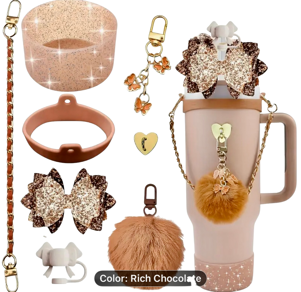 Collection of decorative items CHOCOLATE including a glittery bow, pom-pom keychain with accessories on a white background.
