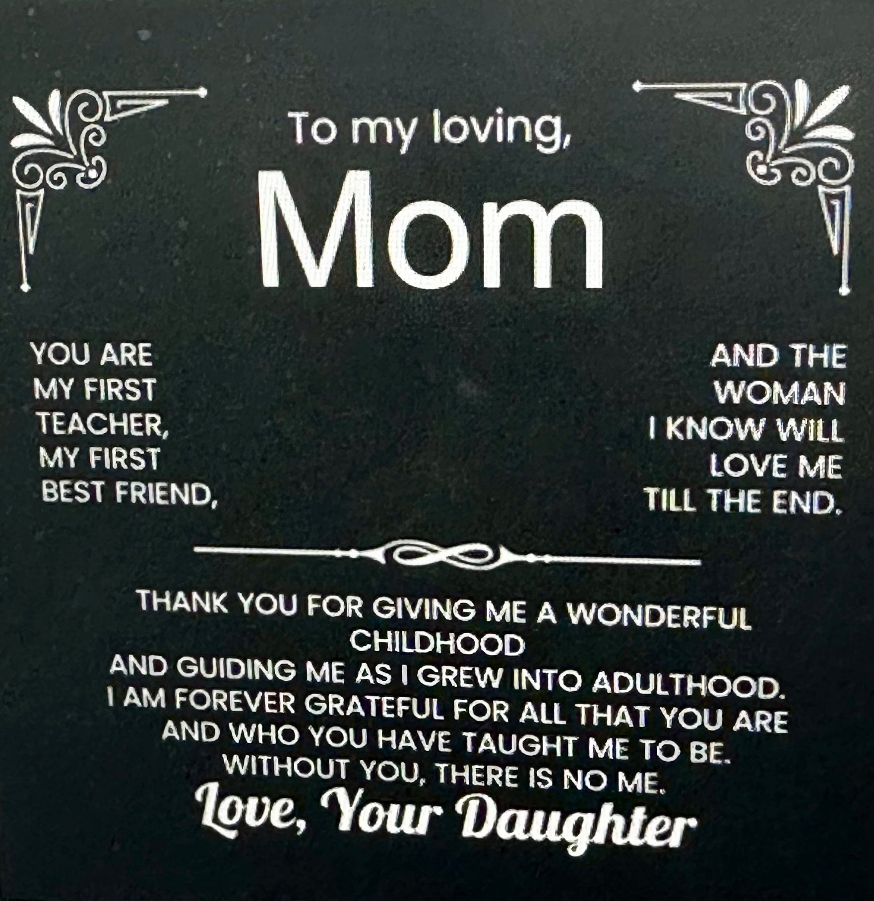 Card with a message to a mom from her daughter on a black background