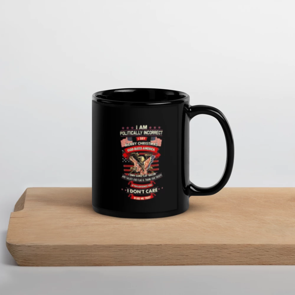 Black mug with a colorful graphic and text on a wooden surface