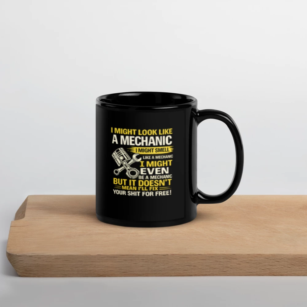 "I MIGHT LOOK LIKE A MECHANIC..." Black Glossy Mug