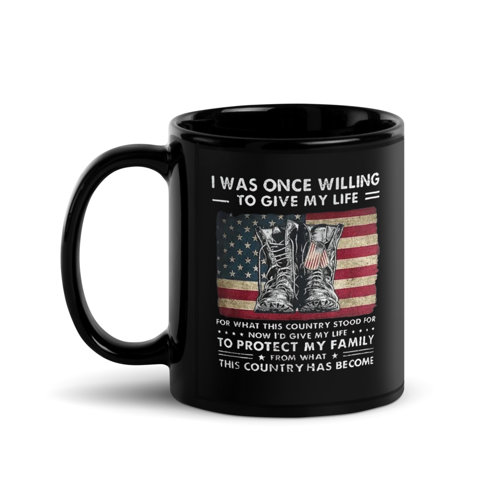 Black mug with American flag and military-themed design on a white background