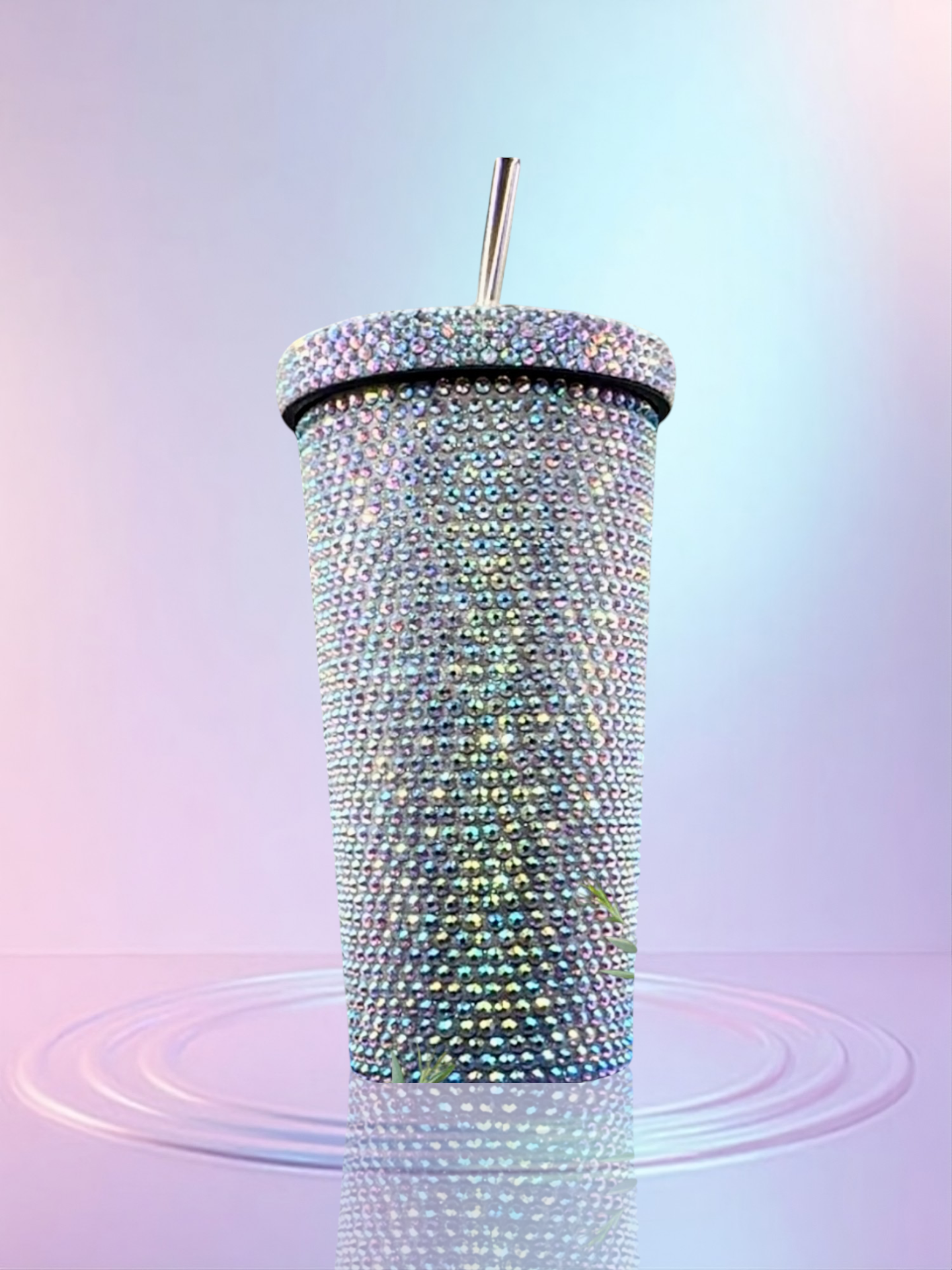 Sparkling tumbler with AB rhinestone embellishments on a gradient background