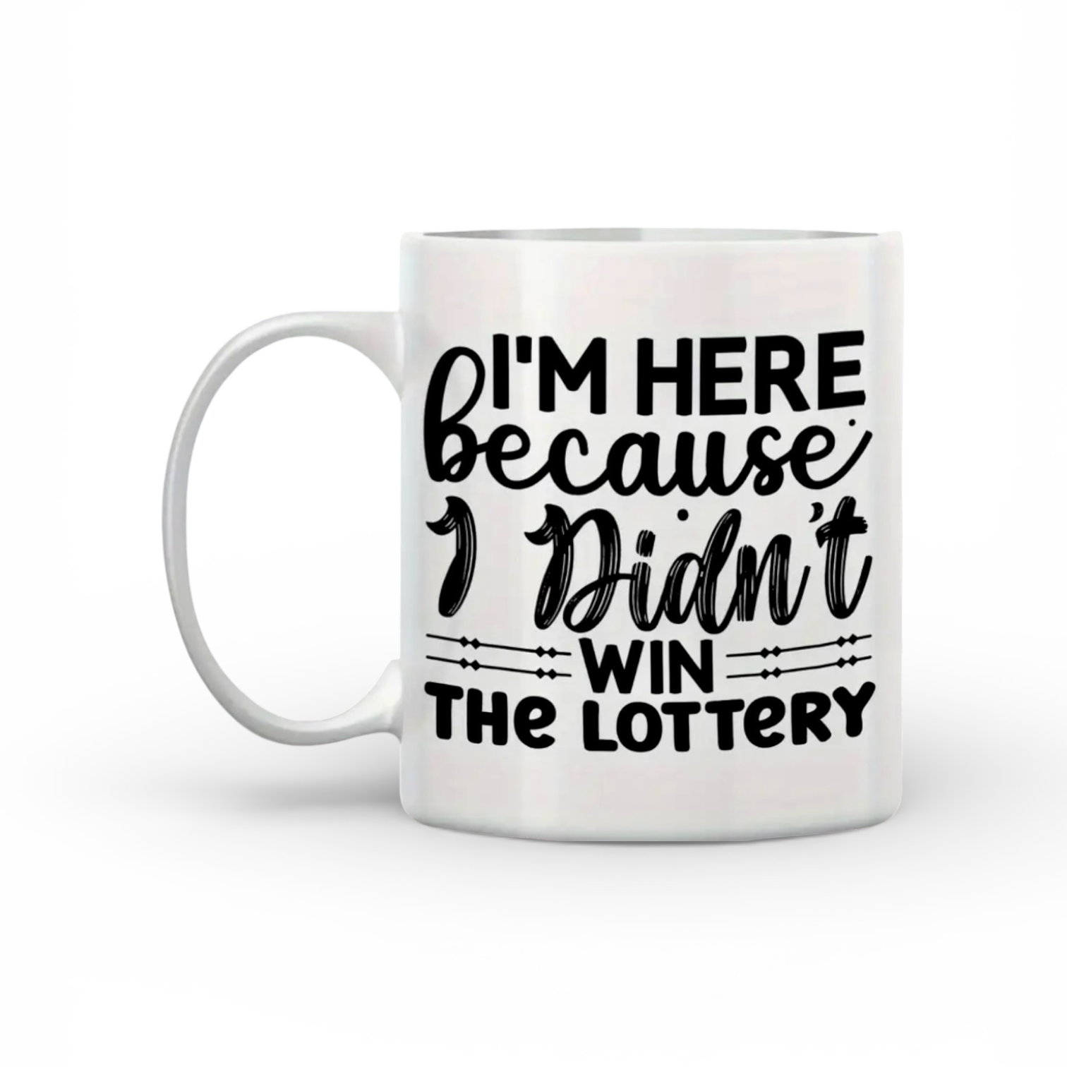 11 oz. White mug with black text 'I'm here because I didn't win the lottery' on a white background