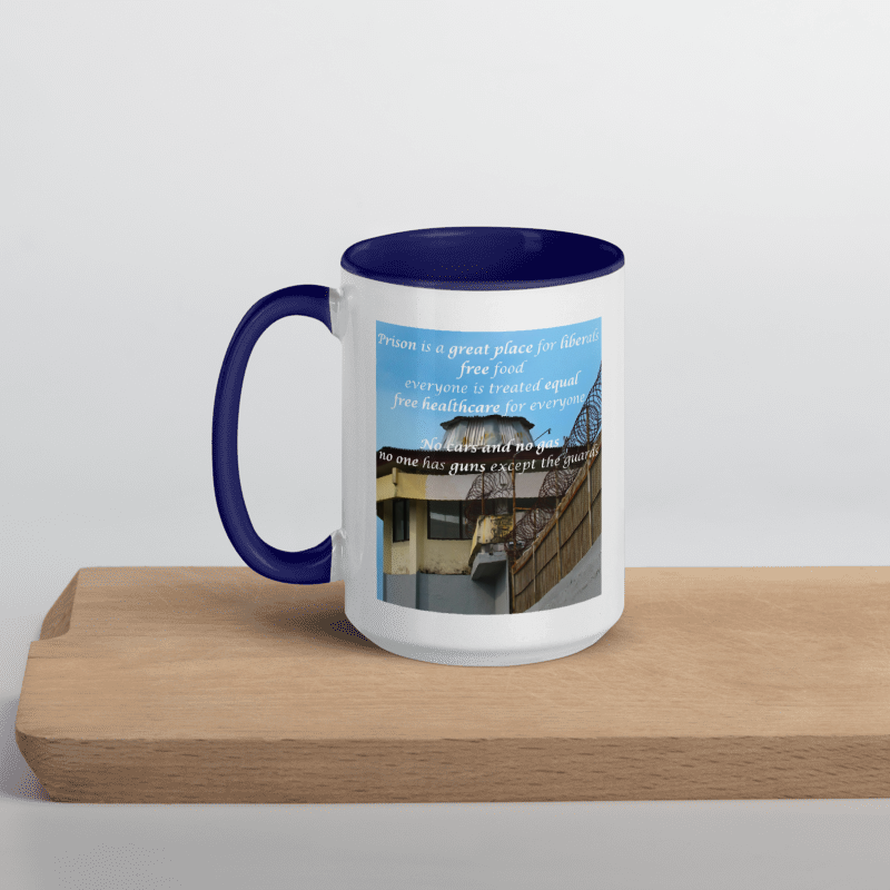 Mug with blue interior and handle, featuring a printed design on a wooden surface.