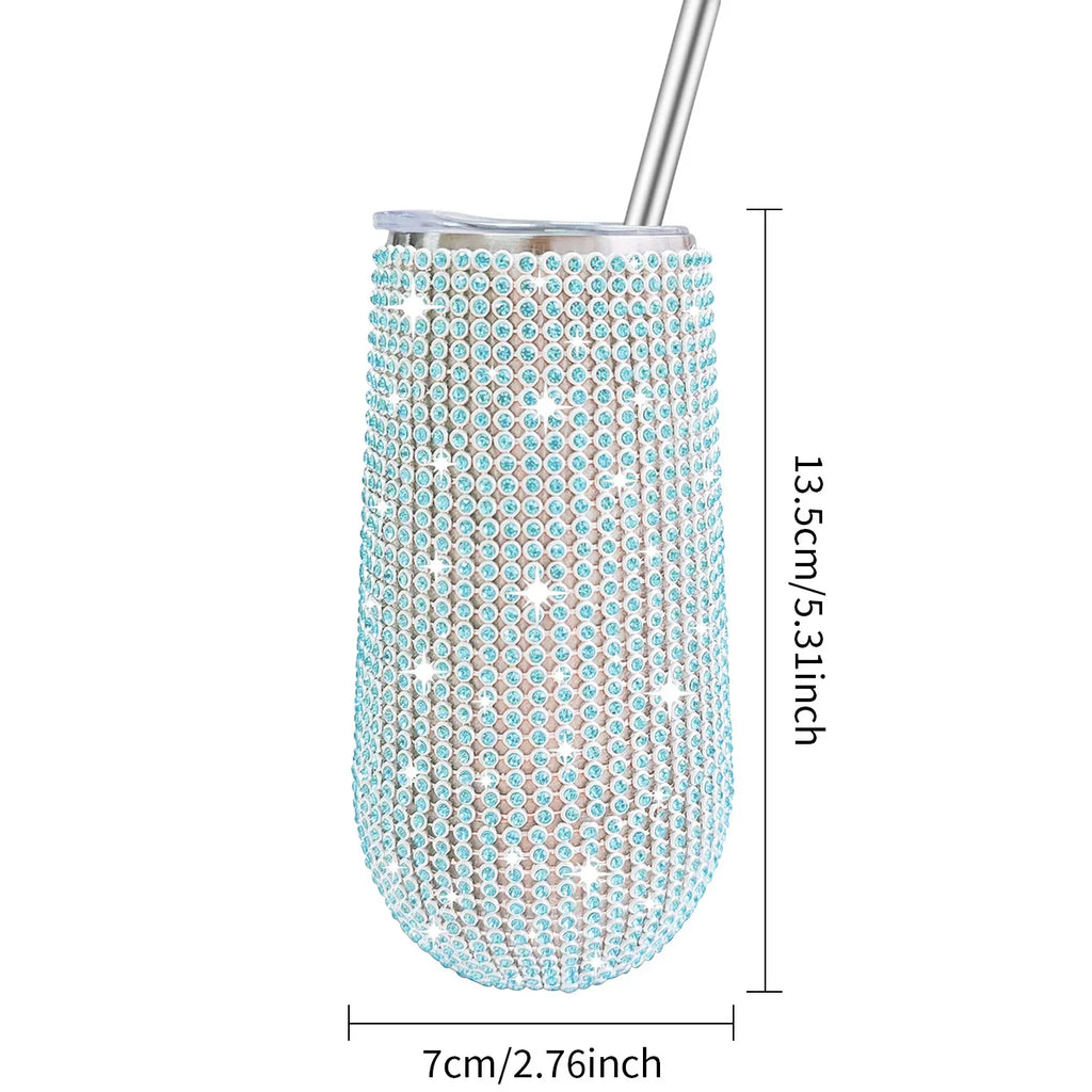 Tumbler with blue rhinestone embellishments and dimensions on a white background