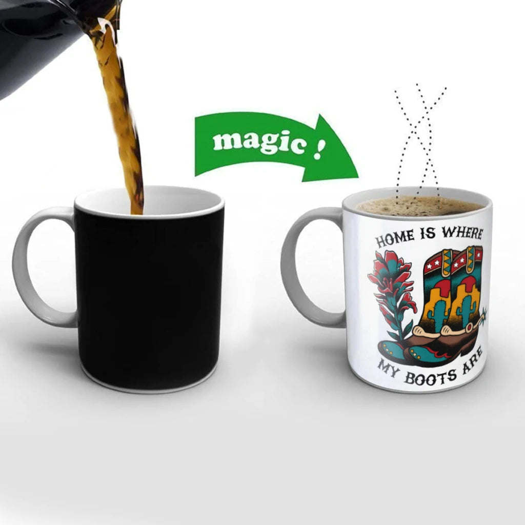Two mugs, one black and one with a colorful design, on a white background.