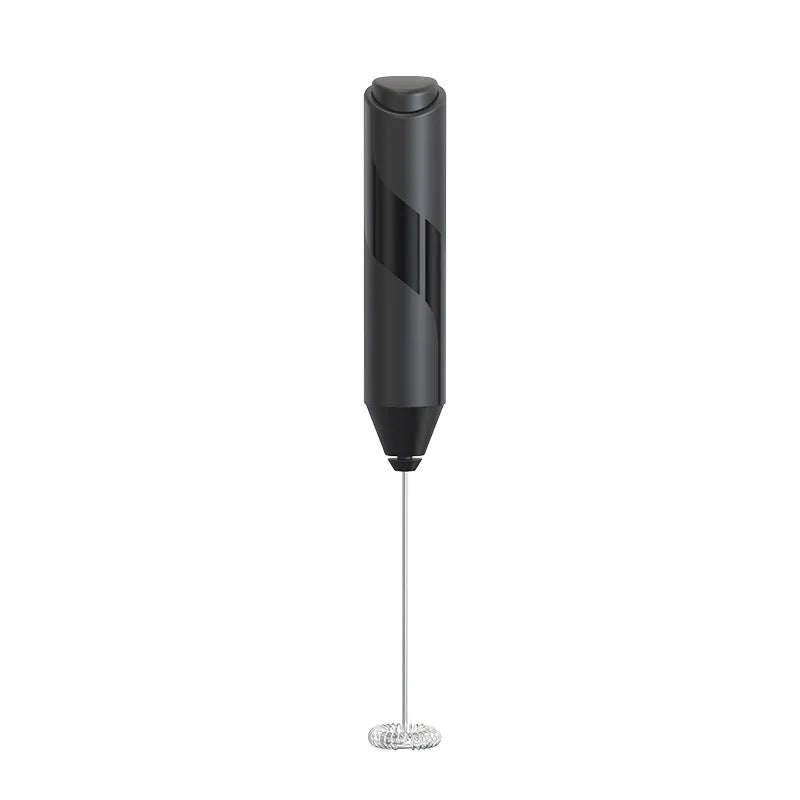 Black handheld milk frother on a white background