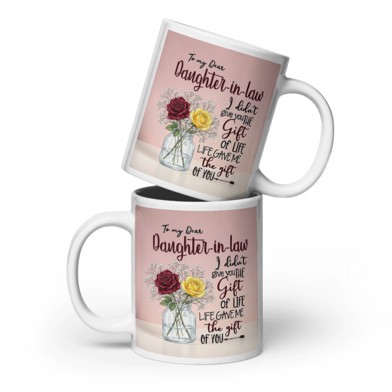 Two white ceramic mugs stacked on a white background, featuring a custom printed design with a pink background, floral illustration, and a sentimental message for a daughter-in-law.