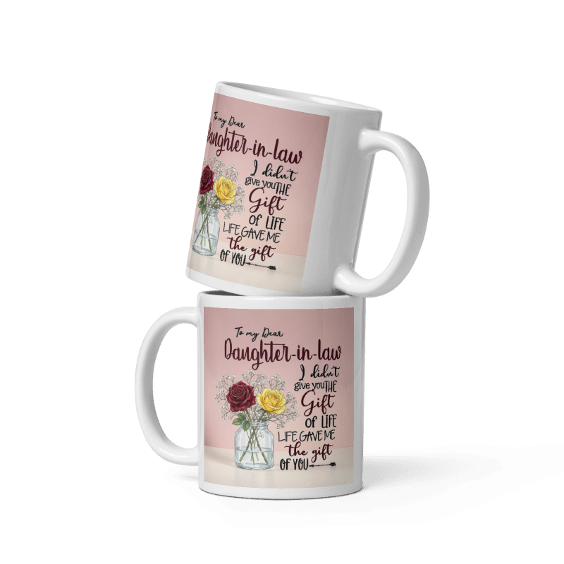 Two stacked white ceramic mugs with a pink printed design featuring a floral illustration and a sentimental quote addressed to a daughter-in-law.