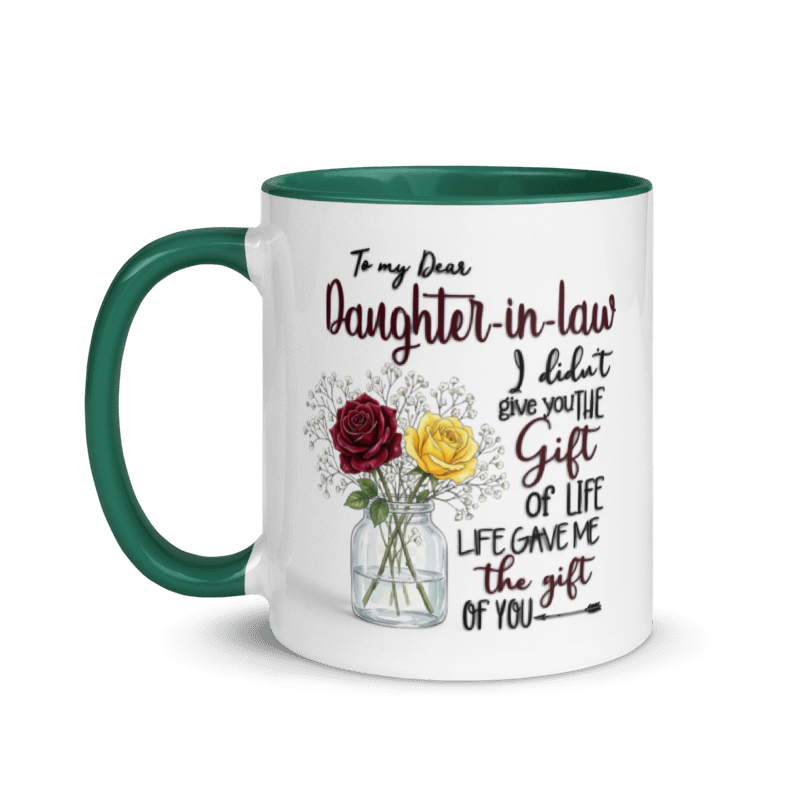 A white ceramic mug with a dark green handle and interior rim, featuring a printed message for a daughter-in-law and an illustration of red and yellow roses in a glass jar, shown on a white background.