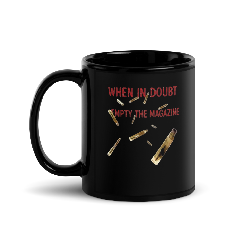 Black mug with text 'When in doubt, empty the magazine' and bullet graphics 