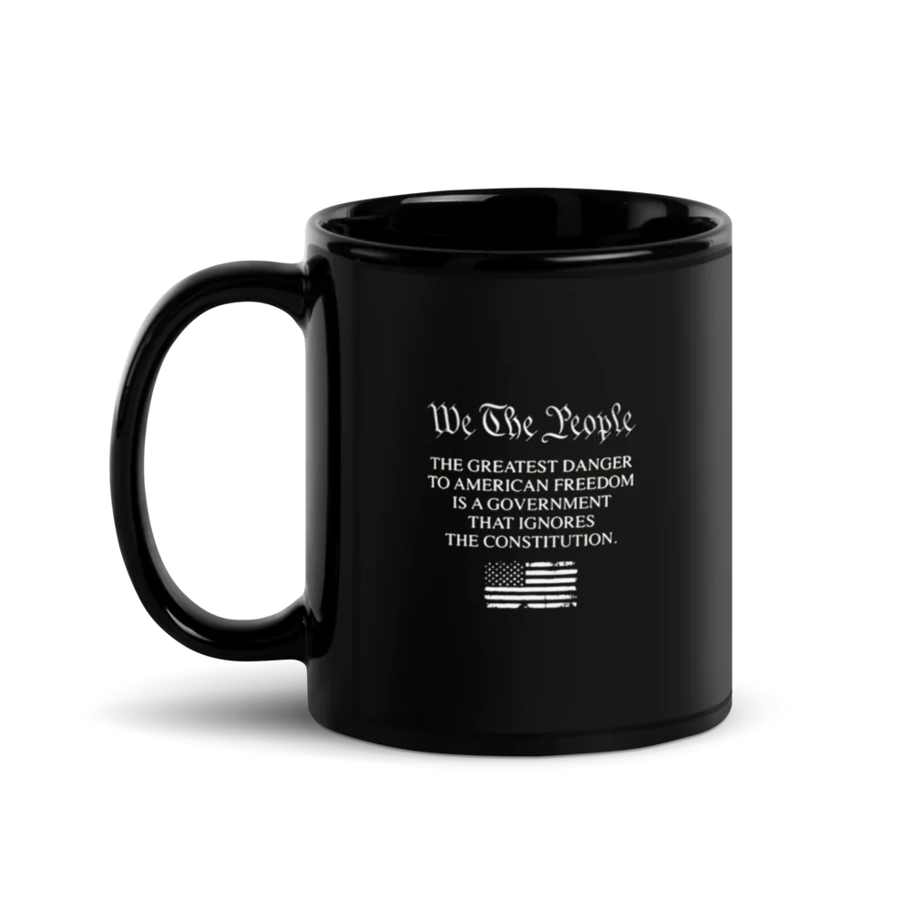 Black mug with text and American flag on a white background